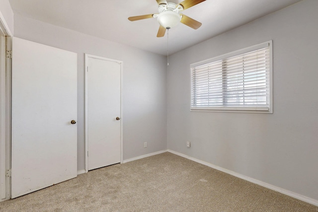 9913 Leyendecker Rd NE, Albuquerque, NM 87112 - unfurnished bedroom featuring light colored carpet, baseboards, and ceiling fan