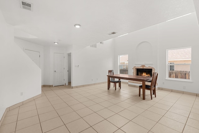 10504 W Connemara Ave SW, Albuquerque, NM 87121 - dining space with a fireplace, light tile patterned floors, baseboards, and recessed lighting