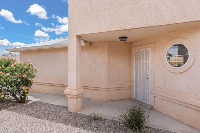 10504 W Connemara Ave SW, Albuquerque, NM 87121 - entrance to property featuring stucco siding and metal roof