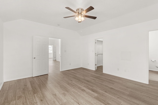 10504 W Connemara Ave SW, Albuquerque, NM 87121 - spare room featuring ceiling fan, light wood finished floors, vaulted ceiling, and baseboards