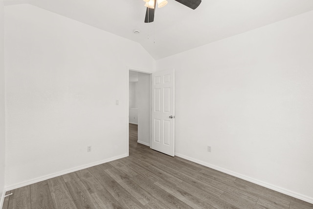 10504 W Connemara Ave SW, Albuquerque, NM 87121 - unfurnished room with wood finished floors, vaulted ceiling, a ceiling fan, and baseboards