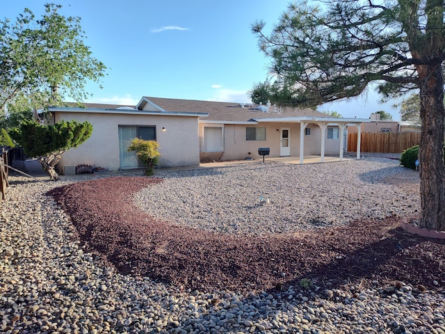 4111 El Cajon Ct SE, Rio Rancho, NM 87124 - back of house featuring stucco siding and a patio