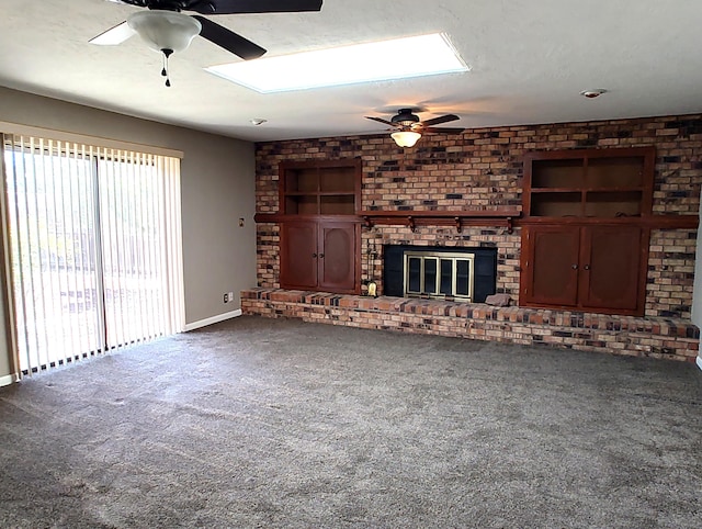 4111 El Cajon Ct SE, Rio Rancho, NM 87124 - unfurnished living room with a ceiling fan, a brick fireplace, and carpet flooring