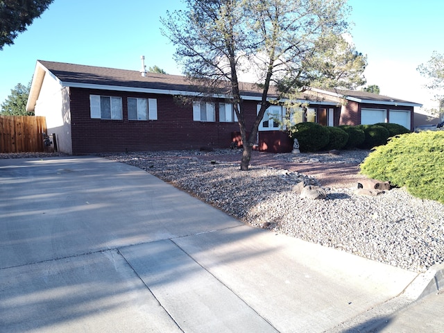 4111 El Cajon Ct SE, Rio Rancho, NM 87124 - ranch-style house featuring brick siding and an attached garage