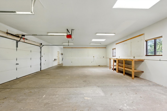1513 33rd Cir SE, Rio Rancho, NM 87124 - garage featuring a garage door opener and a workshop area