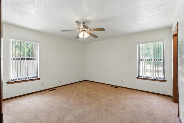 1513 33rd Cir SE, Rio Rancho, NM 87124 - carpeted empty room with ceiling fan, a textured ceiling, and baseboards