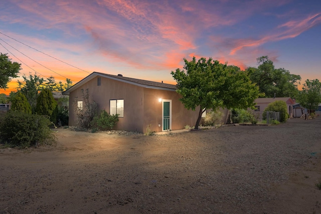 2012 Foothill Dr SW, Albuquerque, NM 87105 - view of front of property with stucco siding and dirt driveway