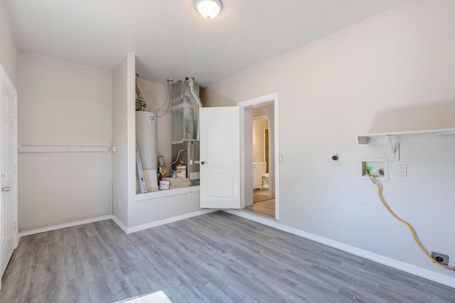 2012 Foothill Dr SW, Albuquerque, NM 87105 - unfurnished bedroom featuring water heater, wood finished floors, baseboards, and a closet