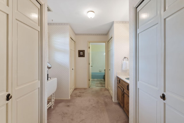 8480 Osuna Rd NE, Albuquerque, NM 87111 - full bath with wallpapered walls, vanity, and baseboards