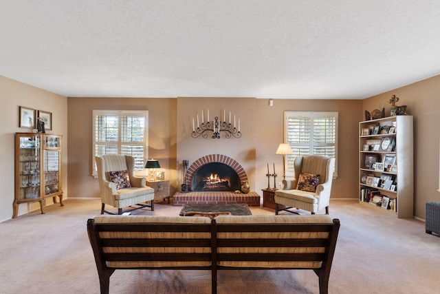 8480 Osuna Rd NE, Albuquerque, NM 87111 - living room featuring light carpet, plenty of natural light, a fireplace, and a textured ceiling
