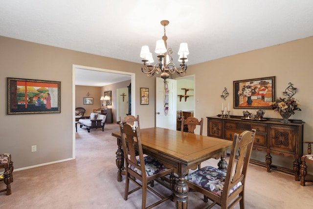 8480 Osuna Rd NE, Albuquerque, NM 87111 - dining area featuring light carpet, a chandelier, and baseboards