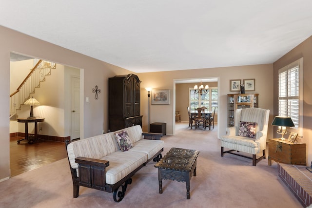 8480 Osuna Rd NE, Albuquerque, NM 87111 - living area featuring a chandelier, light colored carpet, stairs, and baseboards