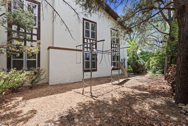 8480 Osuna Rd NE, Albuquerque, NM 87111 - view of side of home featuring stucco siding