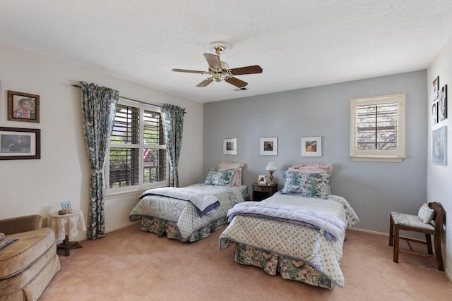 8480 Osuna Rd NE, Albuquerque, NM 87111 - carpeted bedroom with multiple windows, ceiling fan, baseboards, and a textured ceiling