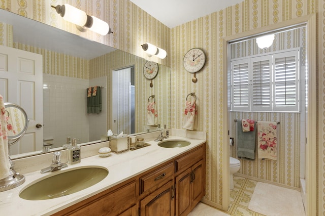 8480 Osuna Rd NE, Albuquerque, NM 87111 - bathroom featuring toilet and double vanity