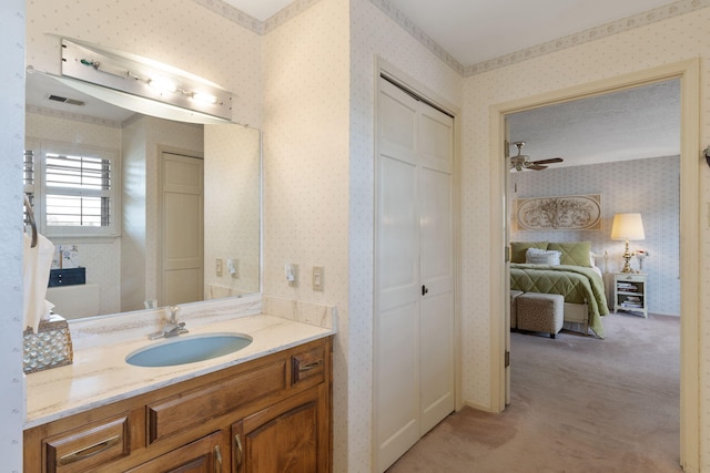 8480 Osuna Rd NE, Albuquerque, NM 87111 - bathroom featuring wallpapered walls, vanity, and a ceiling fan