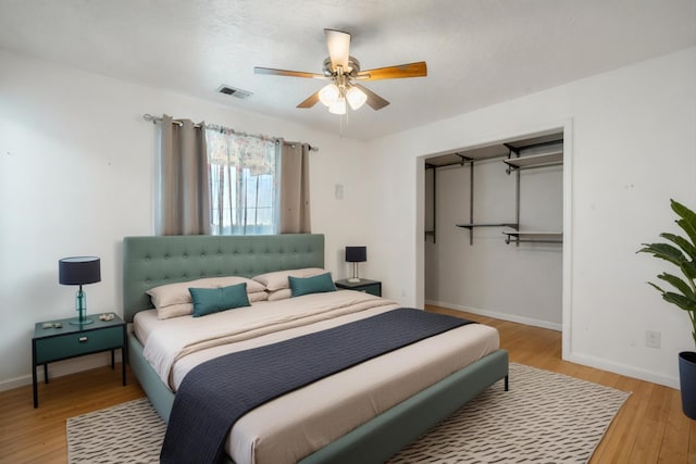4509 Tottle Ave NW, Albuquerque, NM 87114 - bedroom with light wood finished floors, baseboards, a ceiling fan, and a closet