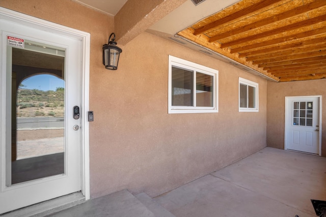 4509 Tottle Ave NW, Albuquerque, NM 87114 - entrance to property with stucco siding and a patio area