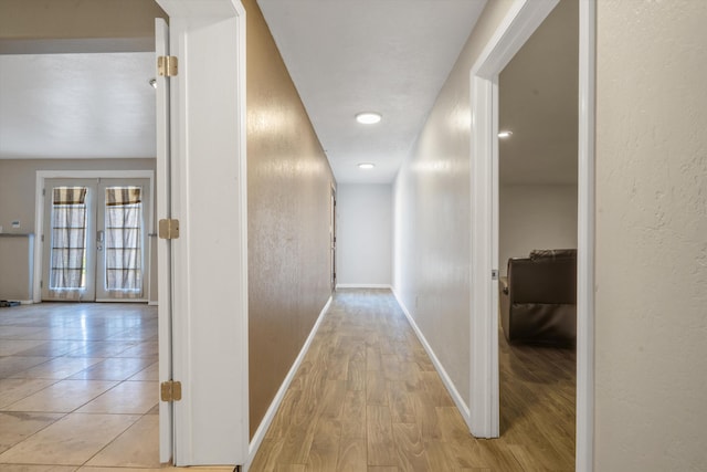 4509 Tottle Ave NW, Albuquerque, NM 87114 - hall featuring french doors, baseboards, a textured wall, light wood finished floors, and recessed lighting