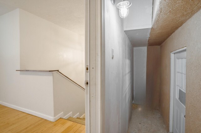4509 Tottle Ave NW, Albuquerque, NM 87114 - hall featuring an upstairs landing, wood finished floors, and baseboards