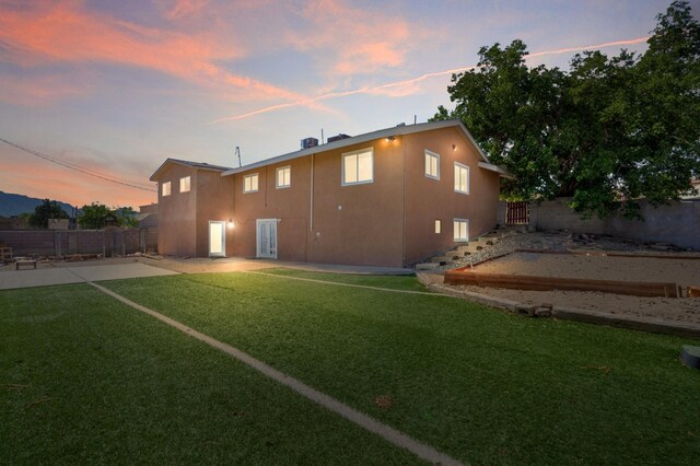 4509 Tottle Ave NW, Albuquerque, NM 87114 - back of house featuring a patio and stucco siding
