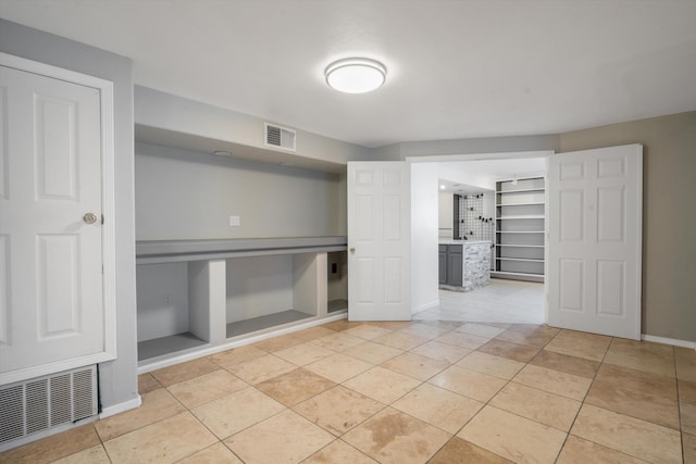 4509 Tottle Ave NW, Albuquerque, NM 87114 - interior space with light tile patterned floors and baseboards