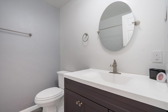 4509 Tottle Ave NW, Albuquerque, NM 87114 - bathroom with vanity, toilet, and baseboards