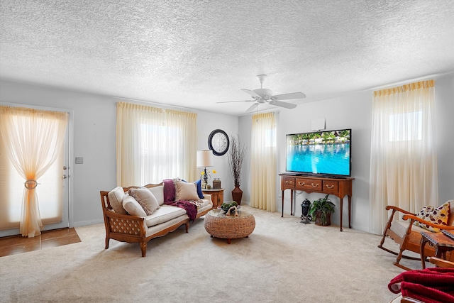 1951 Corta Rustica, Los Lunas, NM 87031 - living room with plenty of natural light, ceiling fan, carpet, and a textured ceiling