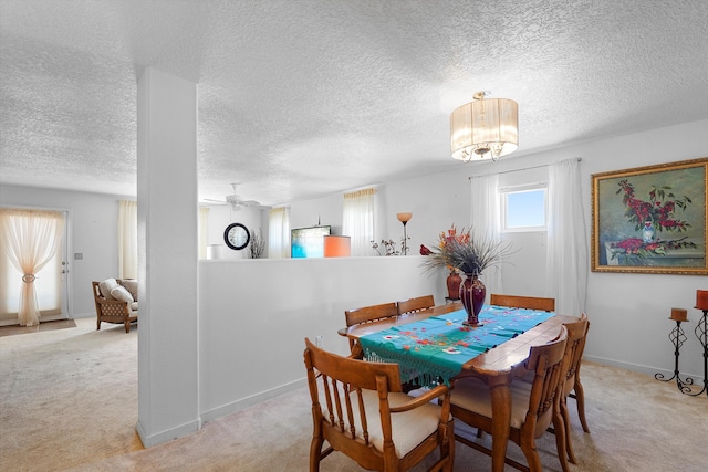1951 Corta Rustica, Los Lunas, NM 87031 - dining room featuring carpet, a textured ceiling, and a chandelier