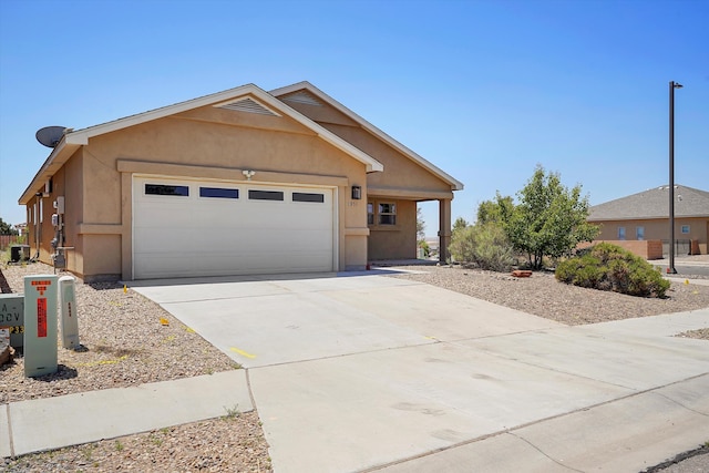 1951 Corta Rustica, Los Lunas, NM 87031 - single story home with a garage, stucco siding, and driveway
