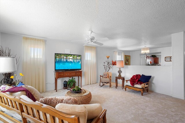 1951 Corta Rustica, Los Lunas, NM 87031 - living room featuring a textured ceiling, carpet, and a ceiling fan