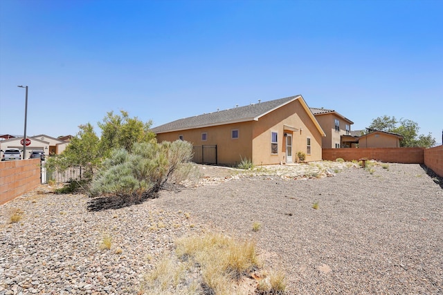 1951 Corta Rustica, Los Lunas, NM 87031 - view of side of property featuring a fenced backyard and stucco siding