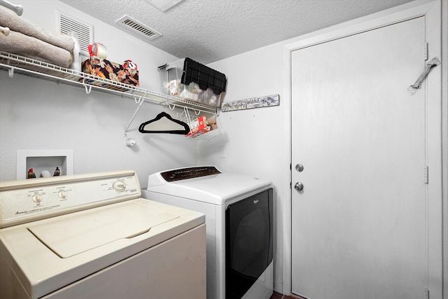 1951 Corta Rustica, Los Lunas, NM 87031 - laundry area featuring washer and clothes dryer and a textured ceiling