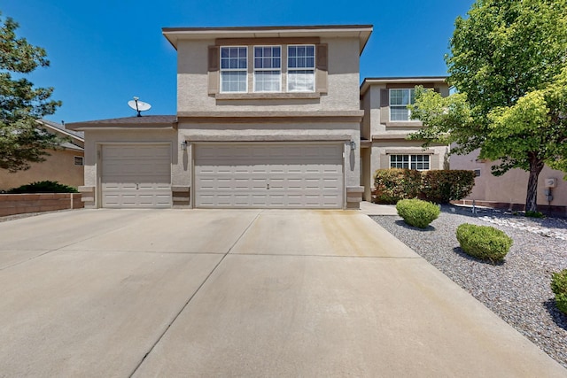9809 Sun Chaser Trl SW, Albuquerque, NM 87121 - traditional-style house with stucco siding, driveway, and a garage