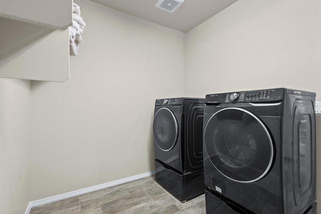 6969 Cleary Loop NE, Rio Rancho, NM 87144 - laundry room with independent washer and dryer and baseboards