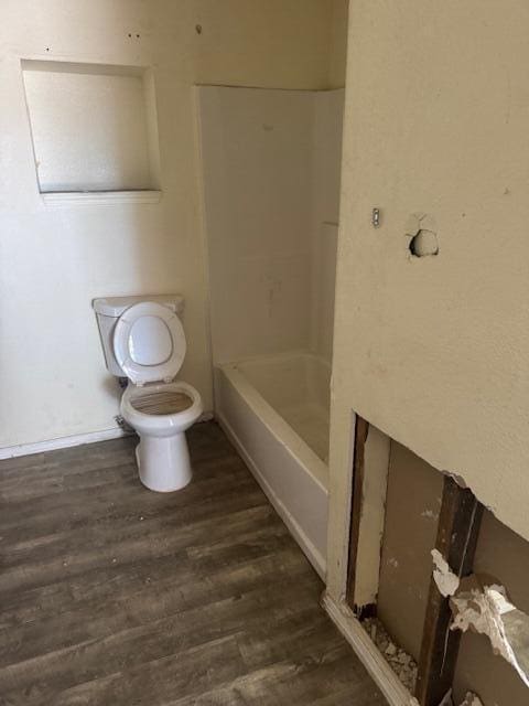 1212 W Reinken Ave, Belen, NM 87002 - full bath featuring toilet and wood finished floors