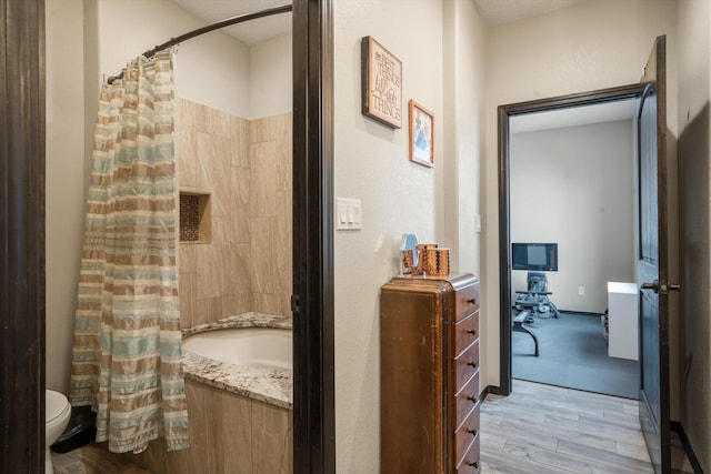 405 Holt Ct NE, Rio Rancho, NM 87124 - bathroom featuring wood finished floors, toilet, shower / bath combo, and vanity