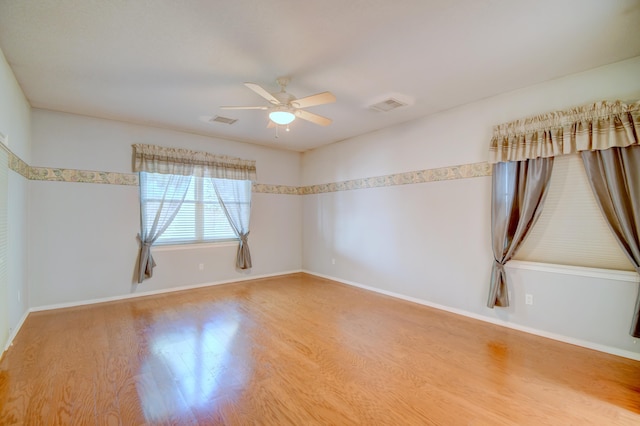 2705 Pueblo Grande Trl NW, Albuquerque, NM 87120 - unfurnished room with wood finished floors, a ceiling fan, and baseboards