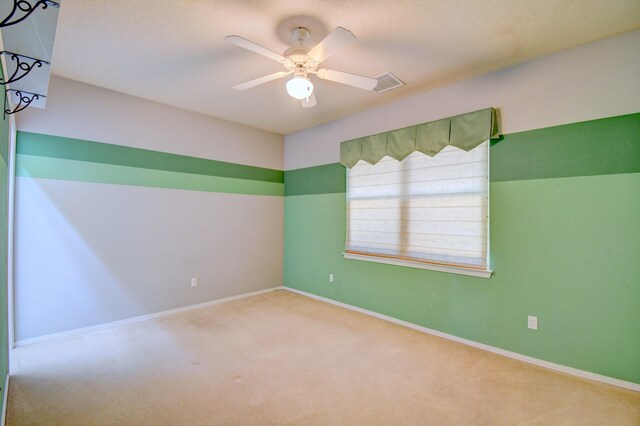 2705 Pueblo Grande Trl NW, Albuquerque, NM 87120 - carpeted empty room with a ceiling fan and baseboards