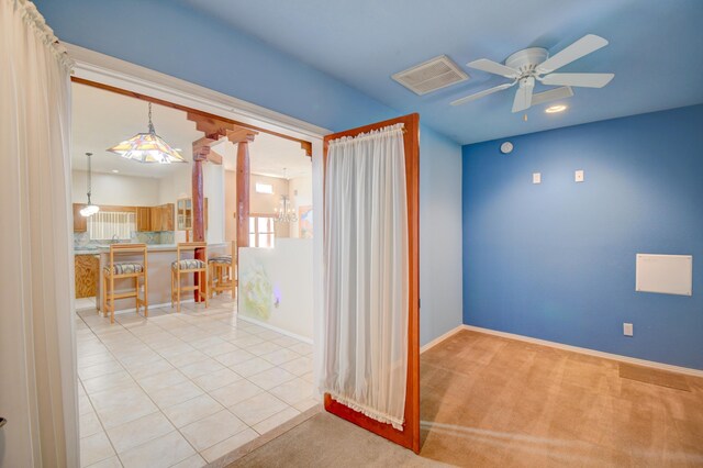 2705 Pueblo Grande Trl NW, Albuquerque, NM 87120 - unfurnished room featuring ceiling fan, ornate columns, baseboards, and light tile patterned flooring