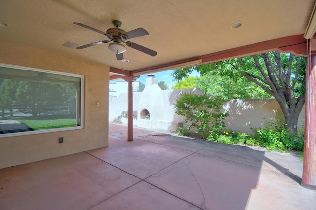 2705 Pueblo Grande Trl NW, Albuquerque, NM 87120 - fenced backyard with a patio area and a ceiling fan