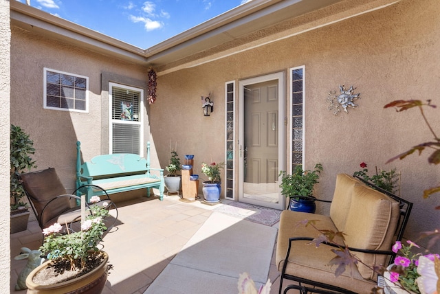 4210 Agave Ct SW, Los Lunas, NM 87031 - view of exterior entry featuring stucco siding and a patio