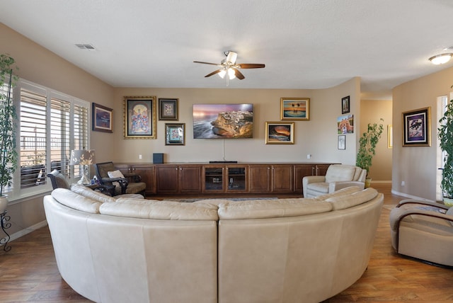 4210 Agave Ct SW, Los Lunas, NM 87031 - living area with ceiling fan, baseboards, and wood finished floors