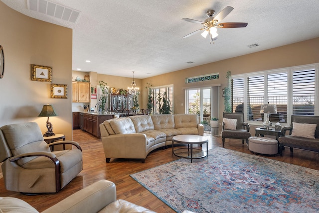 4210 Agave Ct SW, Los Lunas, NM 87031 - living area with a chandelier, a textured ceiling, ceiling fan, light wood finished floors, and recessed lighting