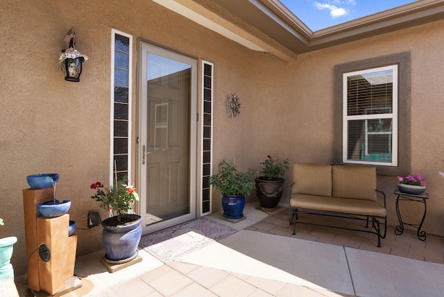 4210 Agave Ct SW, Los Lunas, NM 87031 - property entrance with a patio area and stucco siding