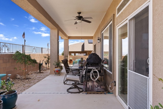 4210 Agave Ct SW, Los Lunas, NM 87031 - fenced backyard with a ceiling fan, a patio area, and outdoor dining space