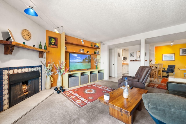 3867 Montgomery Blvd NE Unit 1633, Albuquerque, NM 87109 - living room featuring a textured ceiling and a fireplace