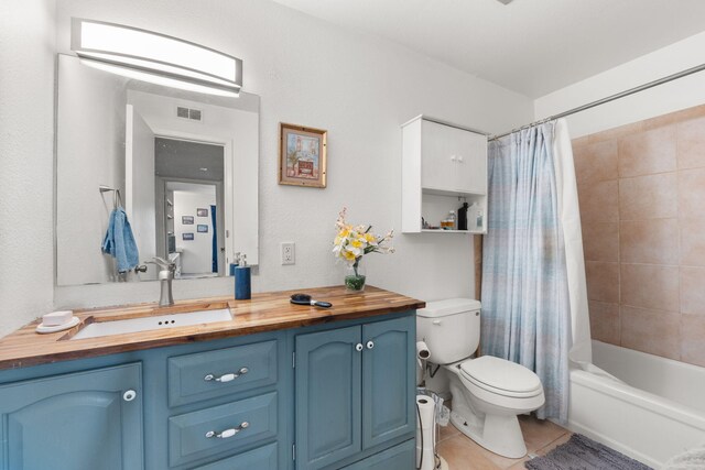 3867 Montgomery Blvd NE Unit 1633, Albuquerque, NM 87109 - full bath with toilet, vanity, shower / bathtub combination with curtain, and tile patterned floors