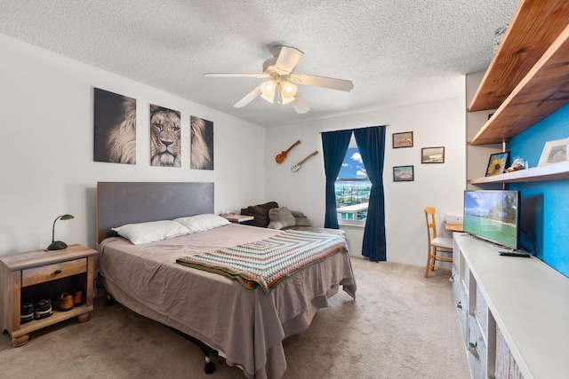 3867 Montgomery Blvd NE Unit 1633, Albuquerque, NM 87109 - bedroom featuring light colored carpet, a textured ceiling, and a ceiling fan