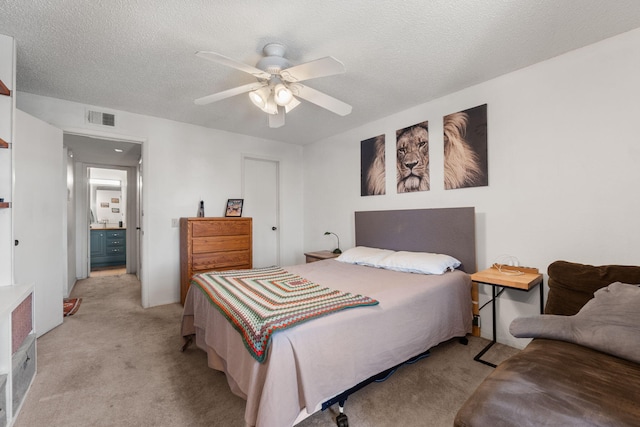 3867 Montgomery Blvd NE Unit 1633, Albuquerque, NM 87109 - bedroom with light colored carpet, a ceiling fan, and a textured ceiling